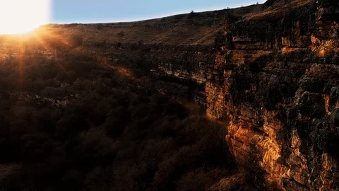 Aerial flight over the gorge. forest. Mountain Ranges at sunset Stock Footage 103428893