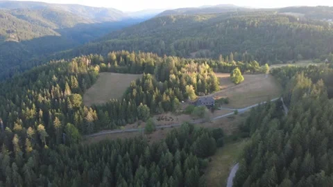 Aerial Flight Over Green Countryside and Rural Roads Stock Footage 343511368