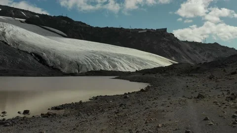 Aerial flight over group of people running on Glacier in Elbrus region. Stock Footage 143111908
