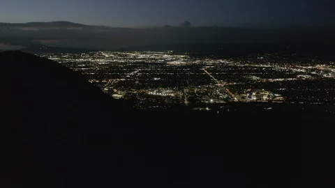 AERIAL: Flight over Hollywood Hills at Night with view on Valley , Burbank and Stock Footage 127836193
