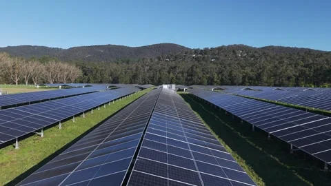 Aerial flight over a large solar farm generating renewable energy Stock Footage 341270390