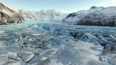 Aerial flight over a massive blue glacier in Iceland Stock Footage 330264876