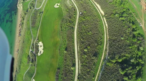 Aerial, Flight over modern golf resort close to sea coast 스톡 동영상 62478656