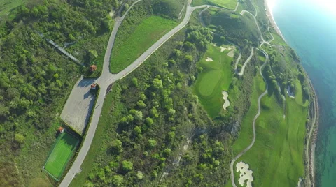 Aerial, Flight over modern golf resort close to sea coast Vidéo 62487657
