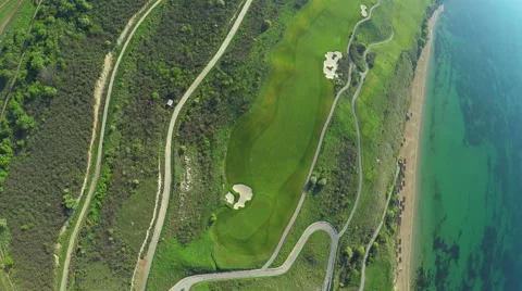 Aerial, Flight over modern golf resort close to sea coast 스톡 동영상 62487819