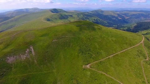 AERIAL: Flight over mountain covered with green grass Stock Footage 78893010