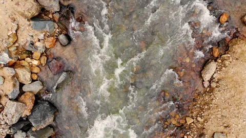 Aerial flight over a mountain river and its rocky shore. Taken by drone Stock Footage 120792318