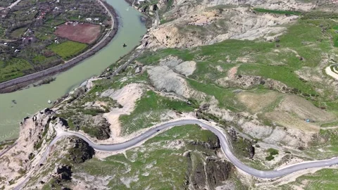 Aerial Flight Over Mountain Road River and Historic Ruins Stock Footage 344800643