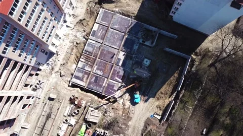 Aerial Flight Over a New Constructions Development Site with Diverse Heavy Stock Footage 230561601