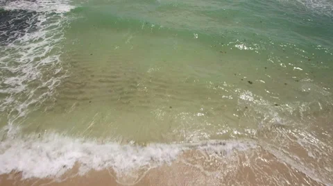 Aerial flight over the ocean from the beach to the open ocean. 4K Ultra HD. Stock Footage 54722946