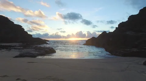 Aerial flight over the ocean in hawaii during sunrise Stock Footage