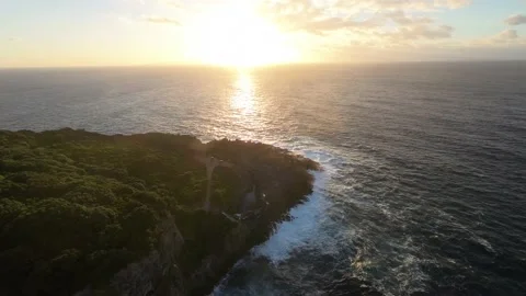Aerial flight over ocean sunset sun Rocky Coastline Waves Crashing Cliffs Azores Stock Footage 221692585