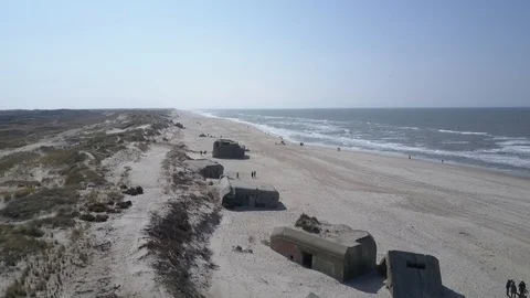 Aerial, flight over old german bunkers and dunes along Danish North sea coast Stock Footage 87254552