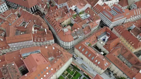 Aerial flight over old town rooftops and courtyards of Graz, Austria Stock-Footage 338291224