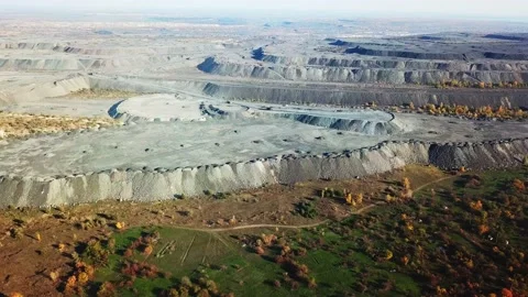 Aerial flight over Open pit iron ore mining Video stock 135803508