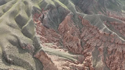 Aerial flight over red eroded canyon ridges, Kok-Moinok Canyons, Kyrgyzstan Stock Footage 347239515