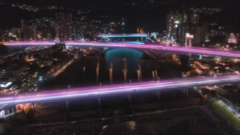 Aerial flight over River with connected bridge lines at night in Stock Footage 158289368