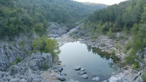 Aerial flight over a river in a forest 스톡 동영상 111581984