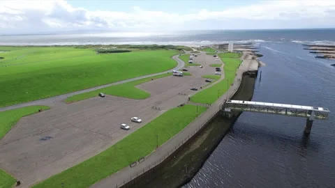 Aerial Flight Over River Irvine Estuary and Pedestrian Footbridge in Scotland Stock Footage 346845300