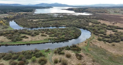 Aerial flight over river meanders toward Orava Reservoir in autumn Stock Footage 346663733
