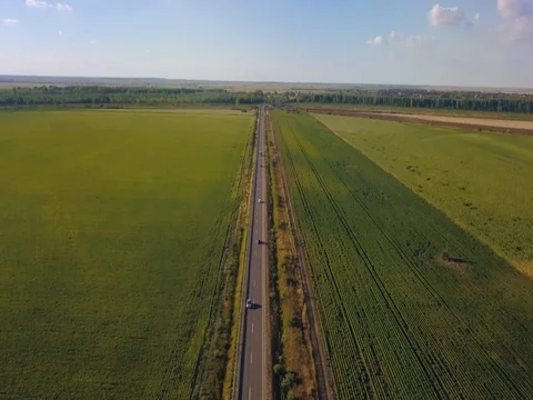 Aerial Flight over the road between fields.  Aerial drone footage 4k Stock Footage 78414297