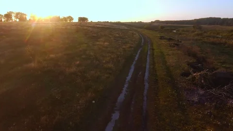 Aerial Flight over the road between fields. Autumn colors. Stock Footage 86855840