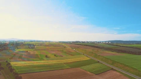 Aerial flight over the road between fields, there is rainbow blick on the Stock Footage 110863477