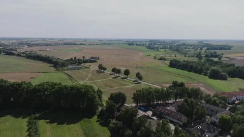 Aerial Flight Over Rural Fields and Village Near Biskupin Stock Footage 325820170