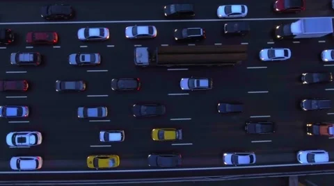 Aerial, flight over slow flow of cars in traffic jam on highway at night. Stock Footage 66418717