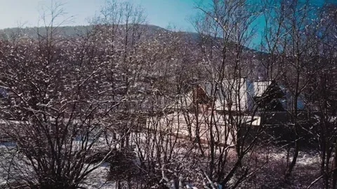 AERIAL: Flight Over Snow Covered Mountain Village and Winter Forest 스톡 동영상 140294539