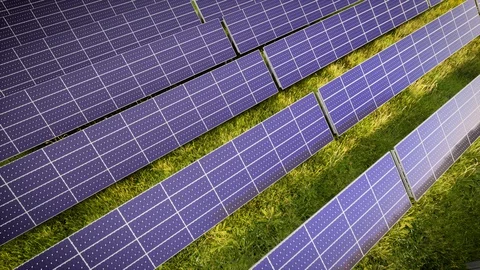 Aerial Flight Over Solar Panel Farm At Green Energy 動画素材 128714853