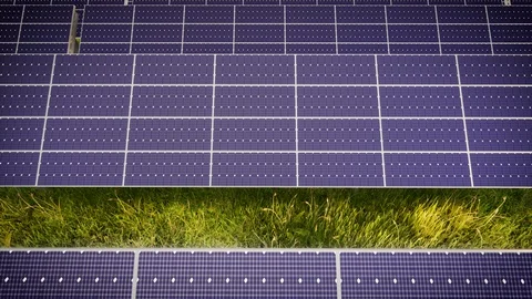 Aerial Flight Over Solar Panel Farm At Green Energy 動画素材 128725965