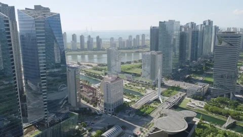 Aerial Flight Over Songdo Toward the Yellow Sea and Incheon Bridge Stock Footage 343828341