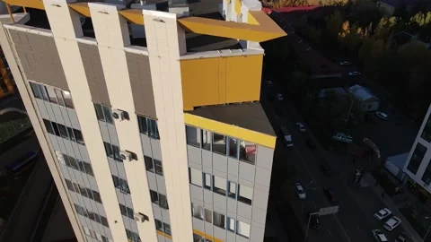 Aerial flight over a triangular building.Architecture. Footage of the building Stock Footage 231630592