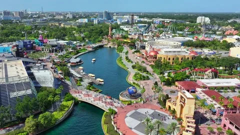 Aerial flight over Universal Studios in Orlando with many visitors on Video stock 280100438
