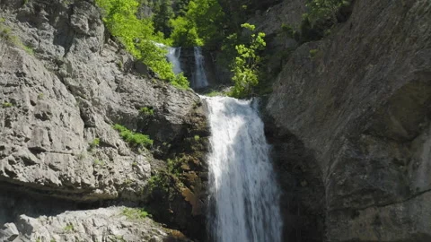 Aerial flight over Upper Falls as we skim over waterfall and tributary stream Video stock 248173821