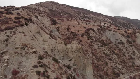 Aerial flight over valley going through a mountain pass. Stock Footage 132344102
