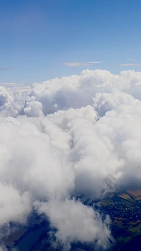 Aerial Flight Over White Clouds Revealing Farmland and Fields Below on Clear Day Stock Footage 340877966