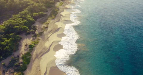 Aerial Flight Over White Sandy Beach and Beautiful Blue Ocean. Amazing Sunris Video stock 56338703