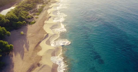 Aerial Flight Over White Sandy Beach and Beautiful Blue Ocean. Amazing Sunris Stock Footage 56339044