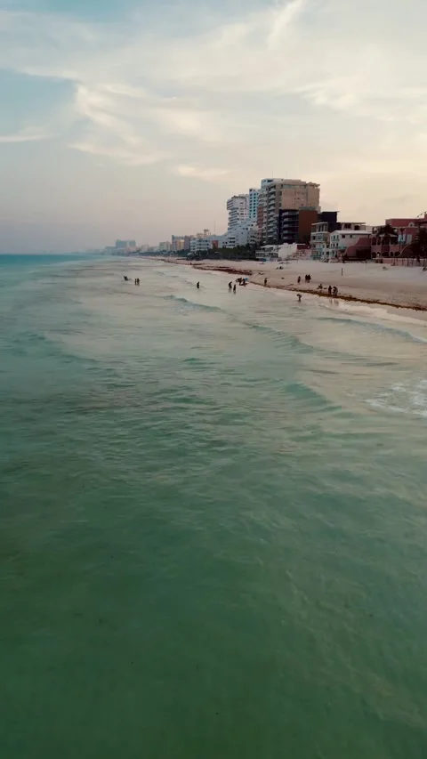 Aerial flight over a wide sandy beach at blue hour in Cancun Stock Footage 342090352
