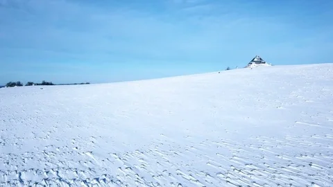 Aerial flight over winter landscape with modern architecture pyramid Stock Footage 83569089