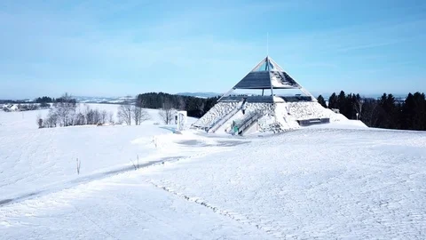 Aerial flight over winter landscape with modern architecture pyramid Stock Footage 83569809