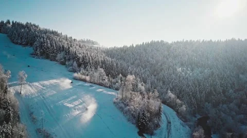 AERIAL: Flight Over Working Snow Makers and Frosted Winter Forest 스톡 동영상 140368499