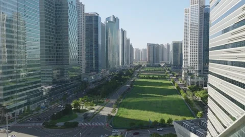 Aerial Flight Past G-Tower Toward Songdo International Business District Stock Footage 343828636
