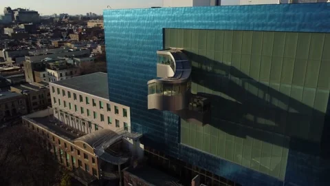 Aerial flight rotating around unique spiral outdoor staircase at AGO in Toronto  Stock Footage 151922780
