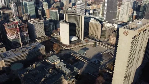 Aerial flight straight down and towards Nathan Phillips Square and Townhall in D Stock Footage 151921901