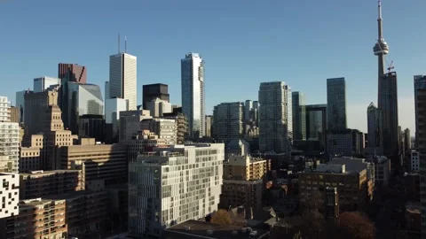 Aerial flight straight down looking southeast at the Toronto skyline as the sun  Stock Footage 151922119