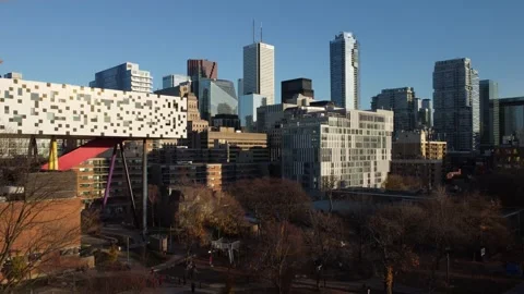 Aerial flight straight down looking southeast at the Toronto skyline as the sun  Stock Footage 151922845