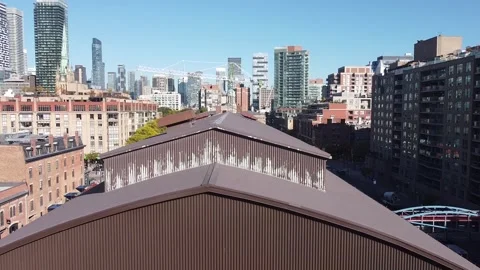 Aerial flight straight down looking at the Toronto skyline and a crane and flyin Stock Footage 151934072